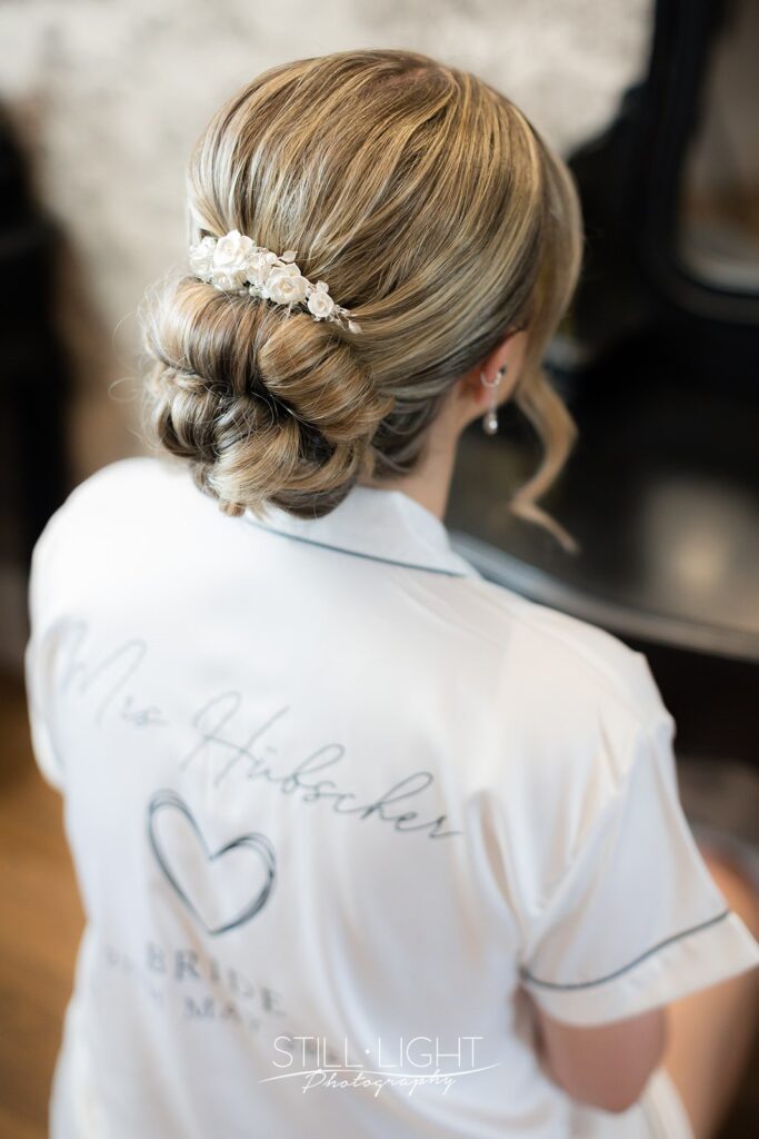 bride getting ready for her wedding day at stanbrook abbey in bride's manor