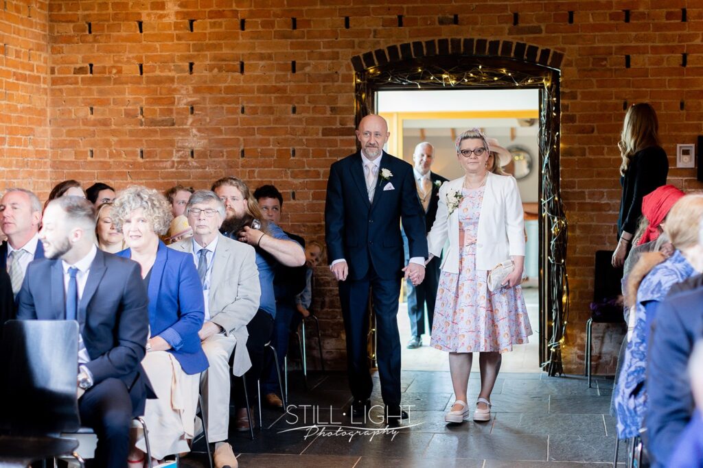 wedding guests in ceremony room red brick barn at redhouse barn