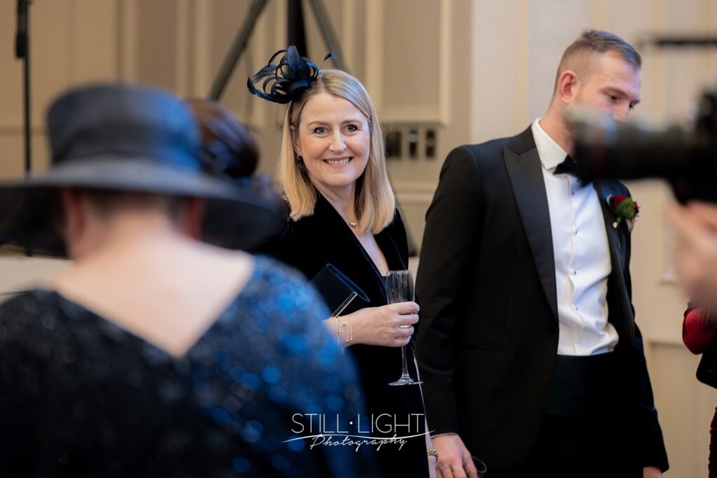 wedding guests during drinks reception at stanbrook abbey hotel