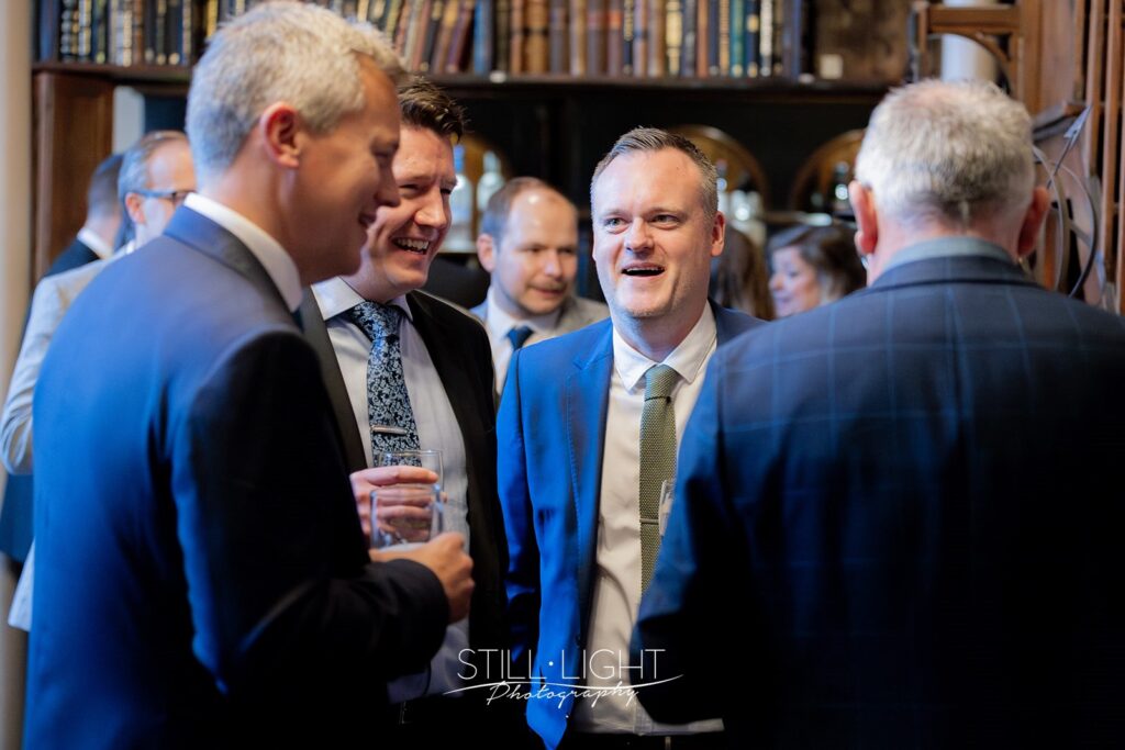 wedding guests during drinks reception at stanbrook abbey hotel