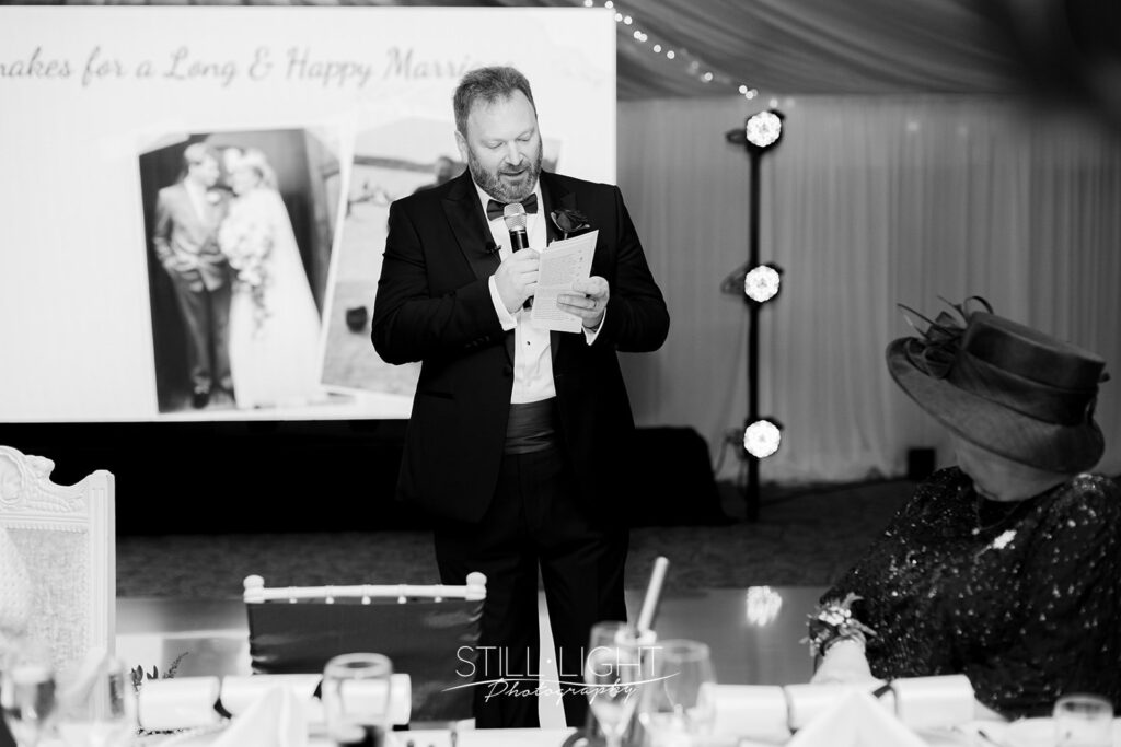 man speaking at wedidng breakfast on winter wedding day at stanbrook abbey hotel