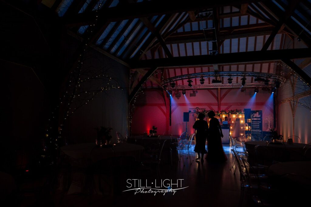 redhouse barn indoor room set up for the evening on autumn wedding day