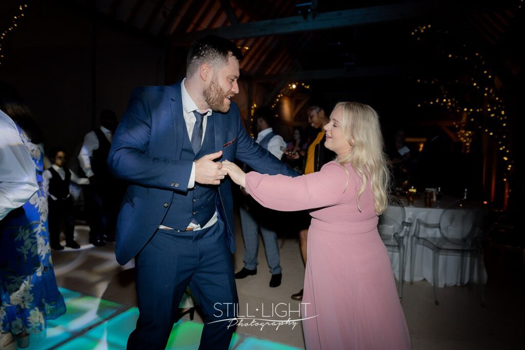 wedding guests dancing and having fun at redhouse barn wedding evening