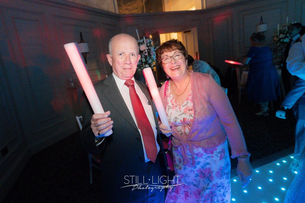 wedding guests on dancefloor in st anne's with glowsticks