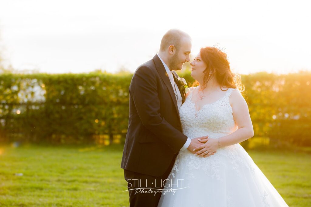 april sunset at redhouse barn with bride and groom