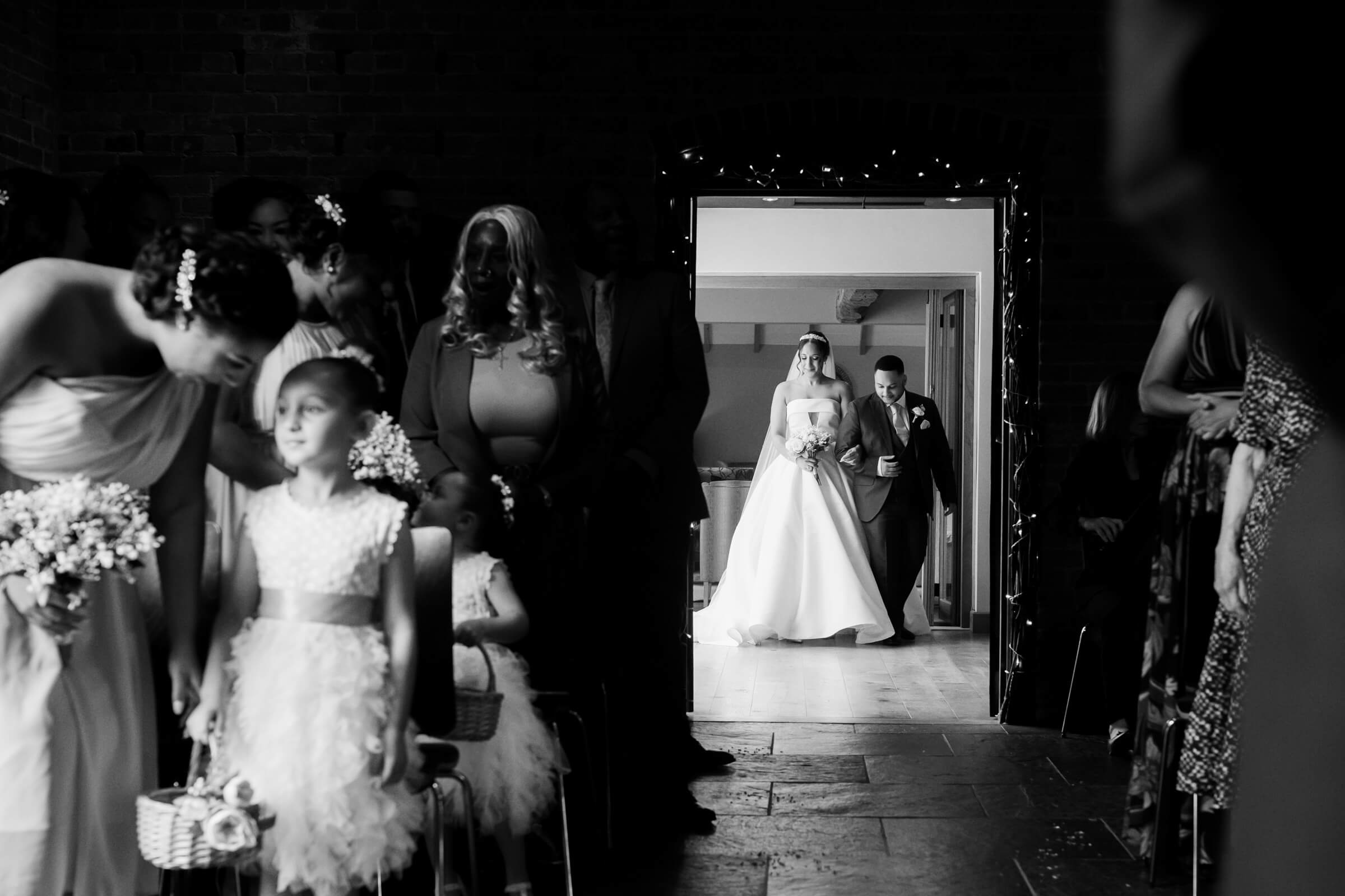 bride and her dad about to enter redhouse barn ceremony room taken by wedding photographer still light photography