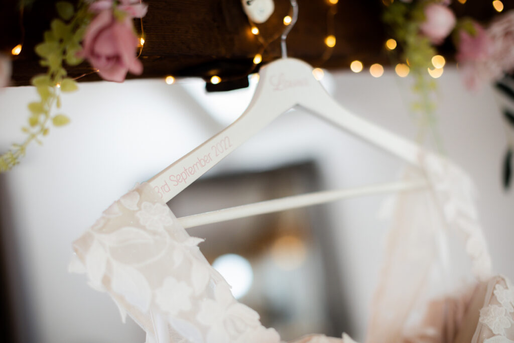 bride's dress hanger in tudor barn at bordesley park