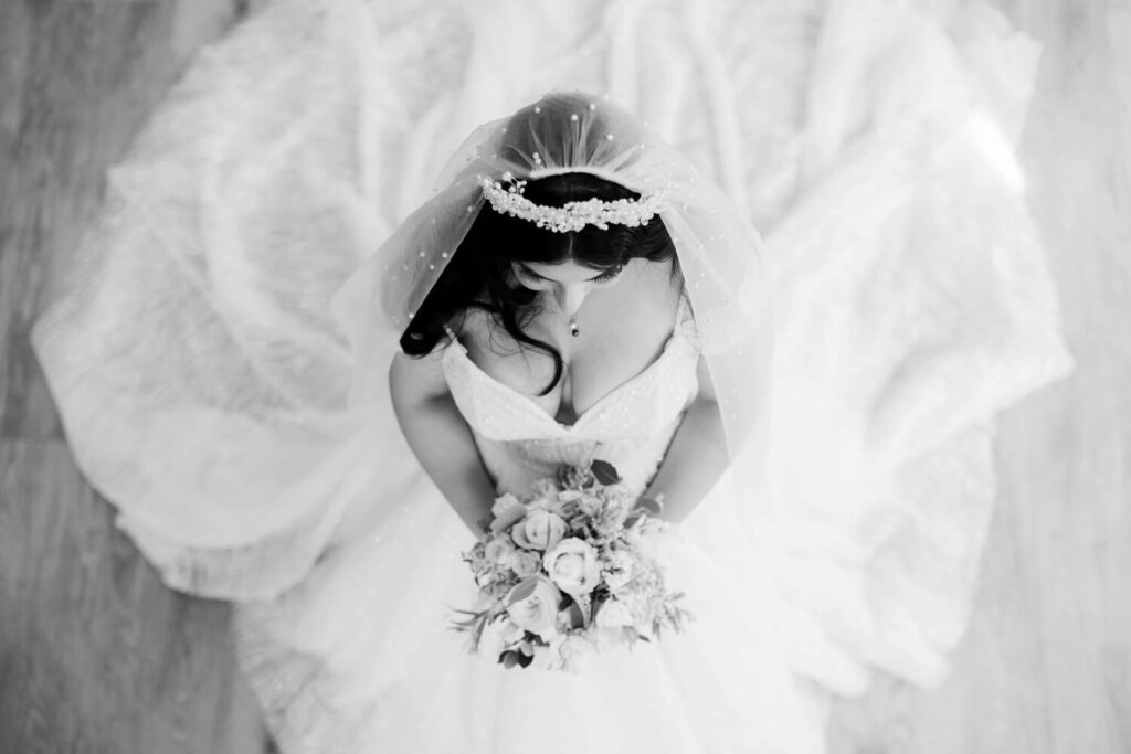 birds eye view shot in black and white of bride holding flowers  by experienced wedding photographers still light photography